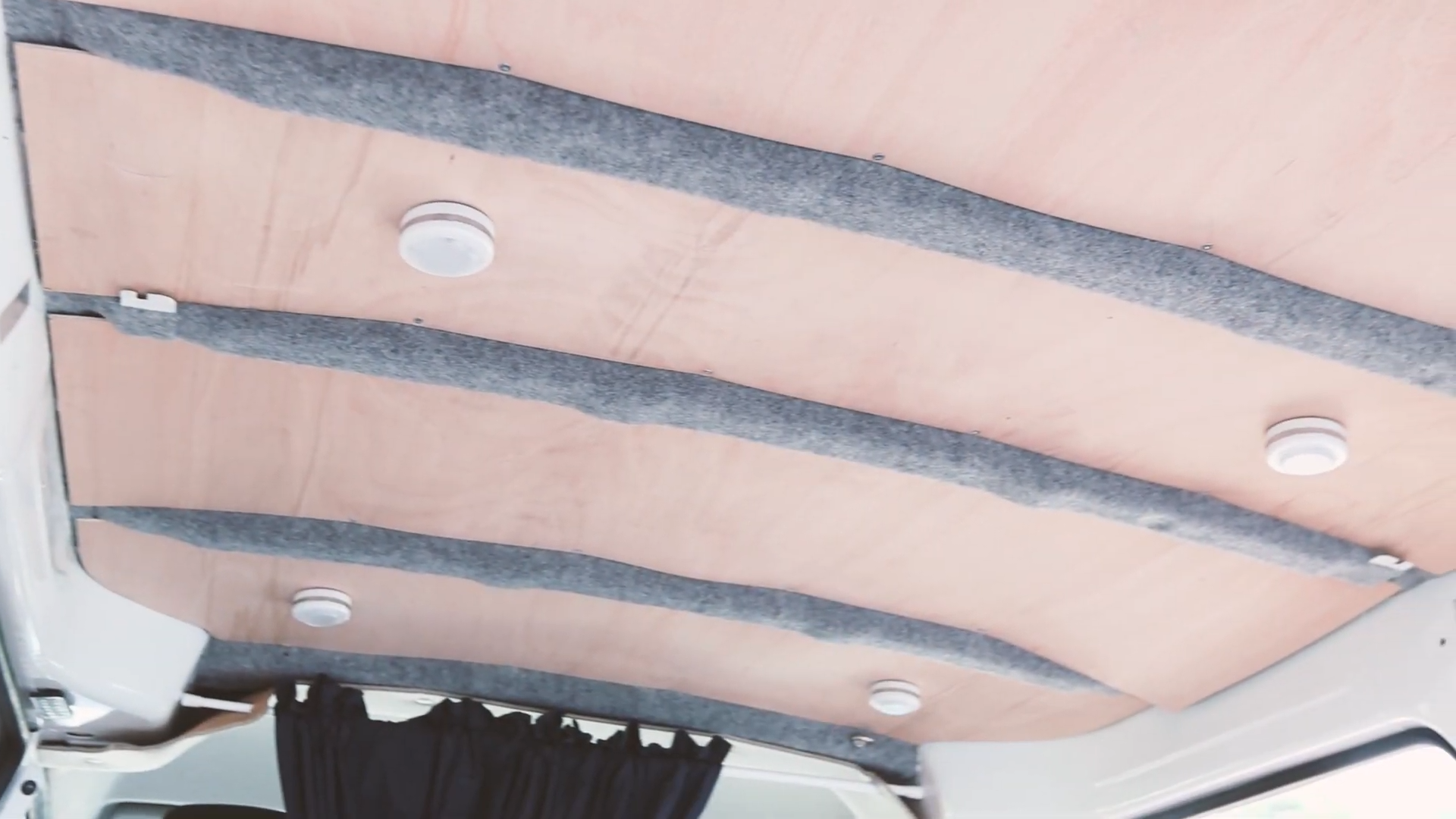 The insulated, carpeted and plywood lined van ceiling