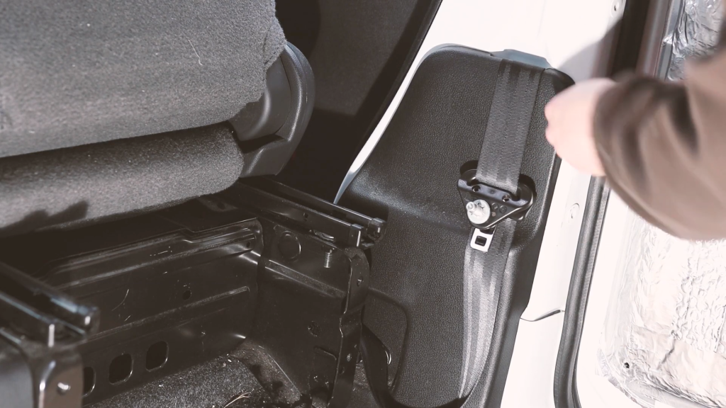 Removing the seatbelt trim in a Nissan NV200