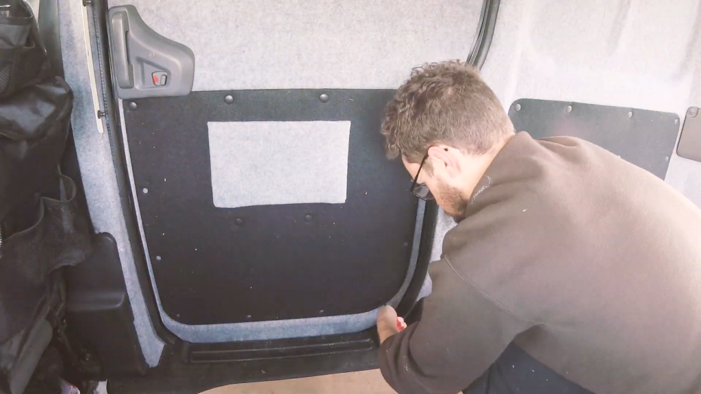 Reattaching the side door panel to the van
